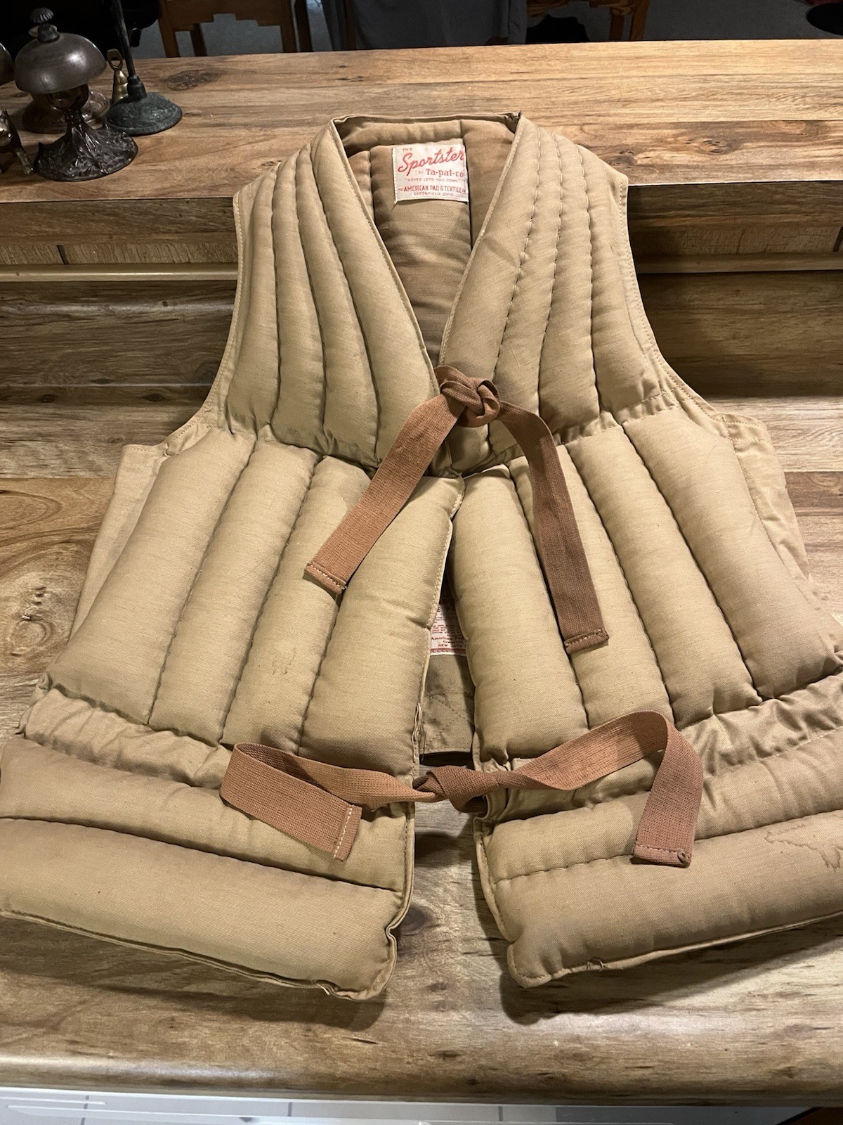 vintage quilted life vest, likely from the 1930s or 1940s, “Sportster”.