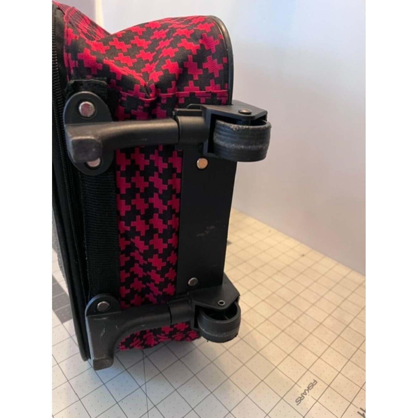 Vintage rolling suitcase distinctive red and black houndstooth collapsible