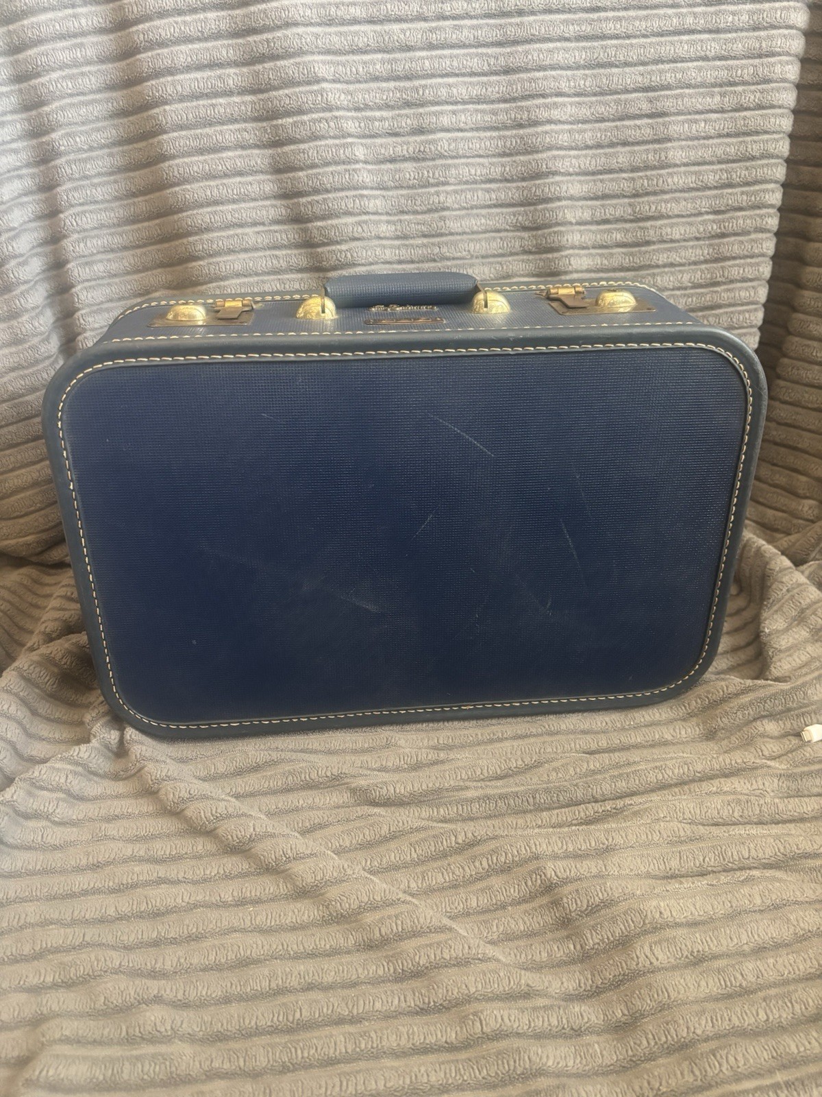 vintage Lady Baltimore hard-shell suitcase in navy blue with brass hardware