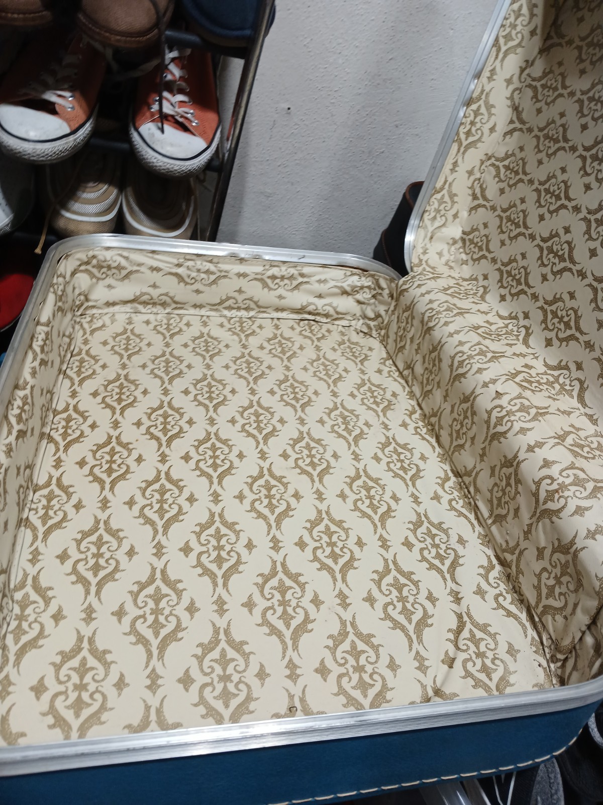 vintage hard-shell suitcase, possibly from the 1960s or 1970s.