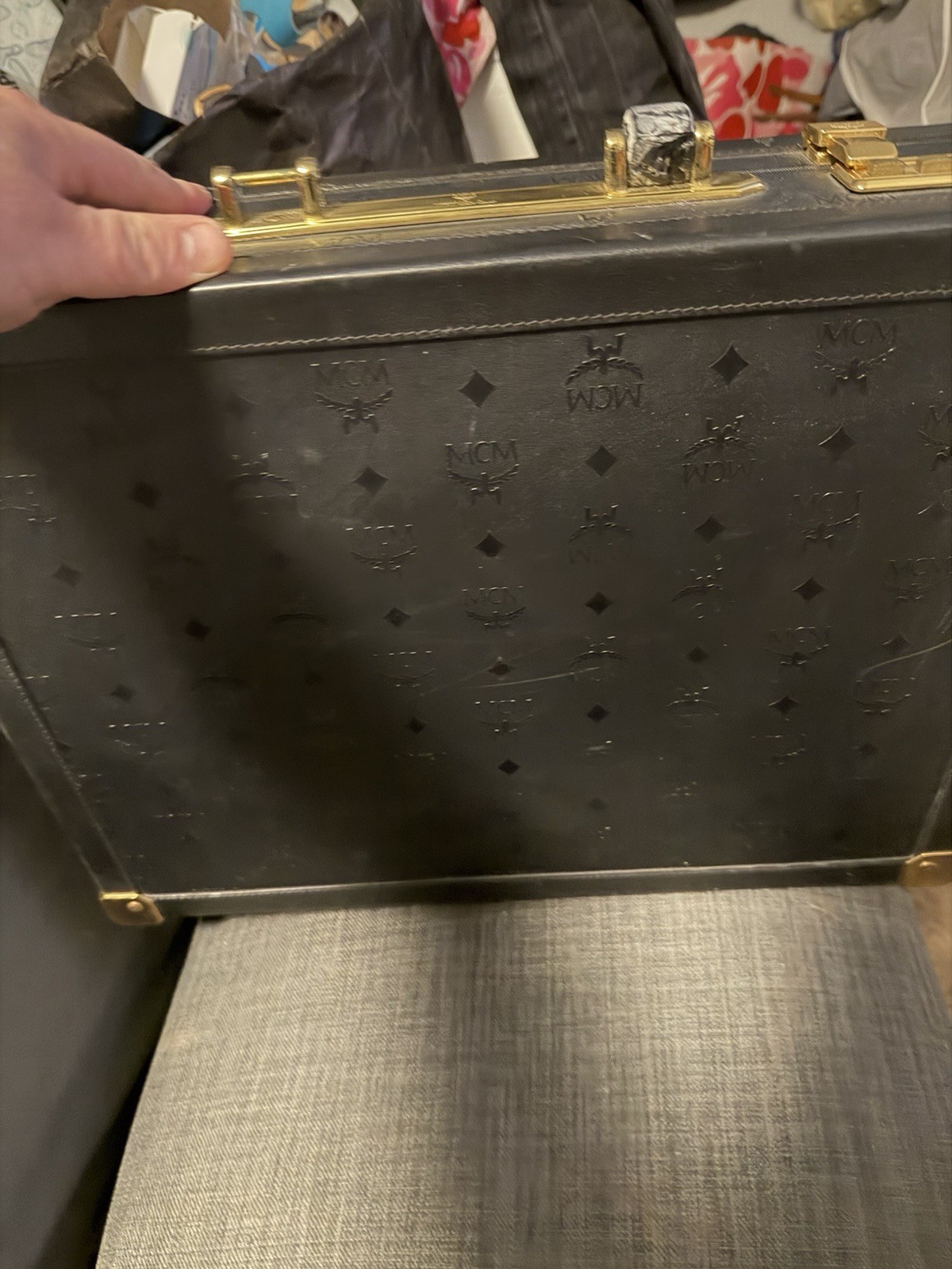 MCM VINTAGE travel case. Heritage series in black with gold-colored fittings.