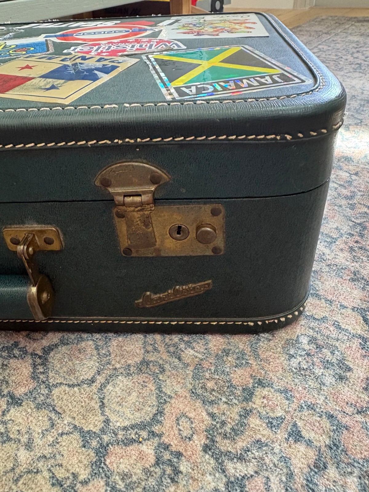 Vintage Carilite hardcover suitcase green 1970s with travel stickers from Europe