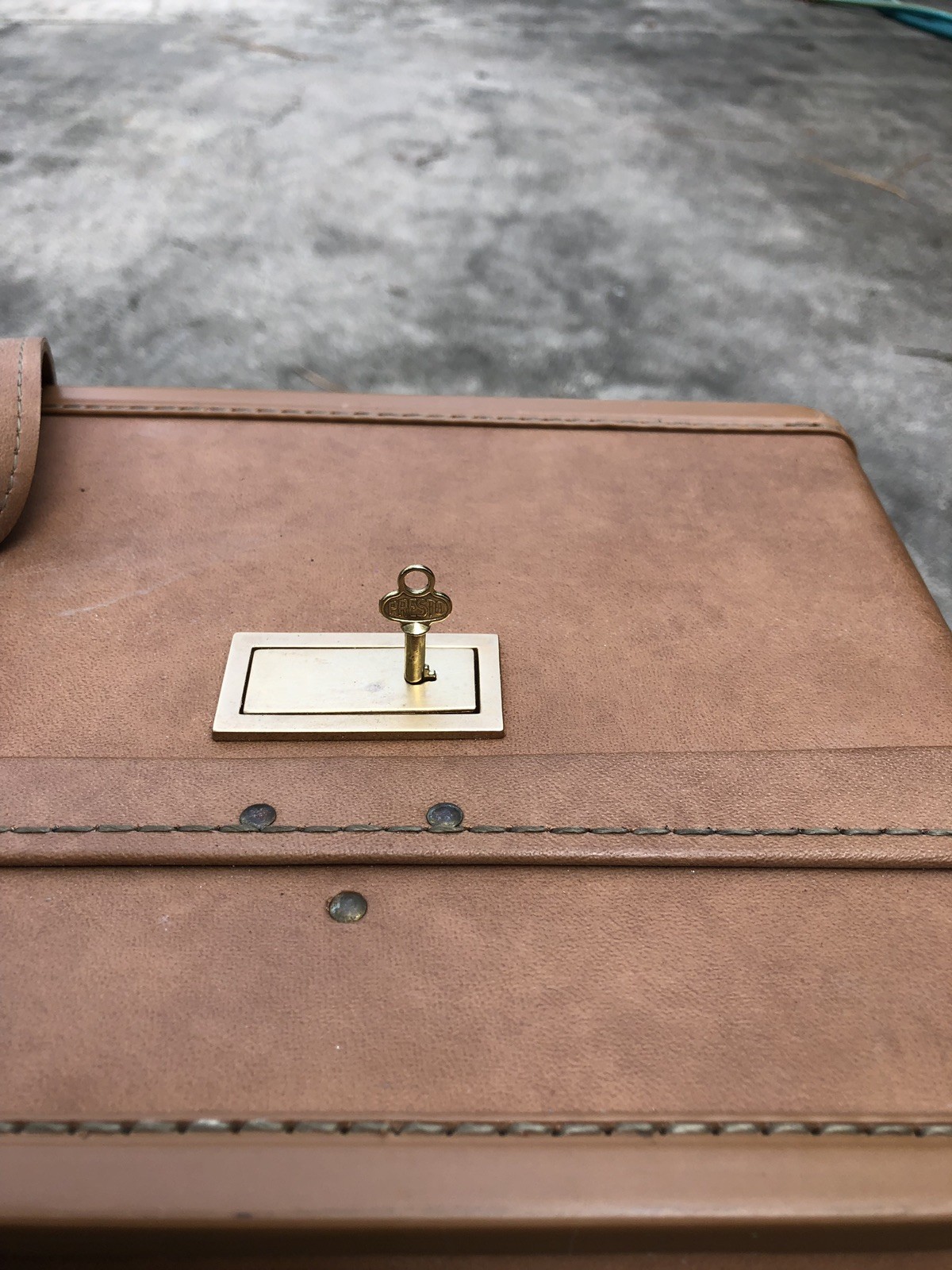 Hartmann 25” Belting Leather Paisley Interior Suitcase